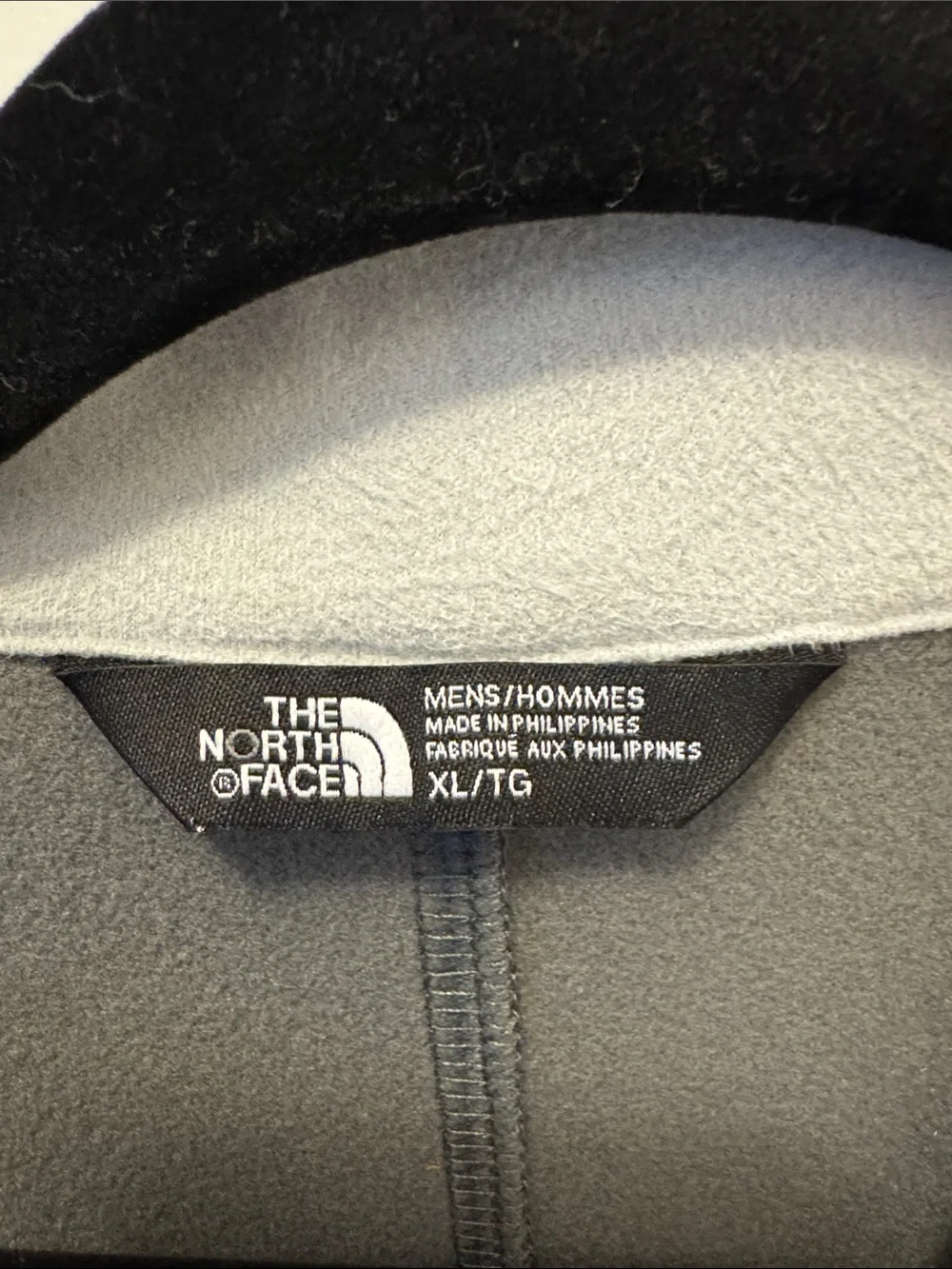 The North Face Gray Jacket with Blue Accents